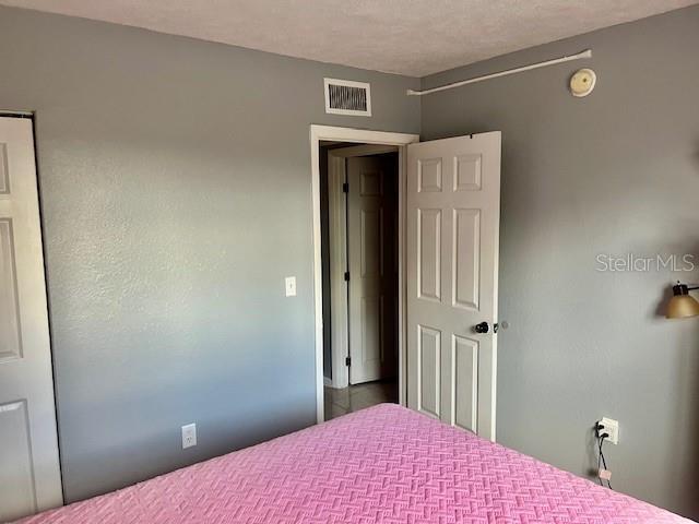 bedroom featuring visible vents