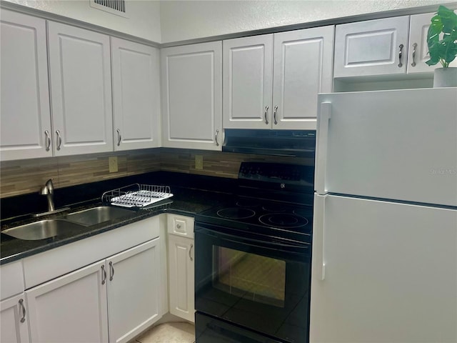 731 Wyman Ct Unit 731-A, Orlando, FL 32809 - kitchen with freestanding refrigerator, black / electric stove, extractor fan, a sink, and white cabinets