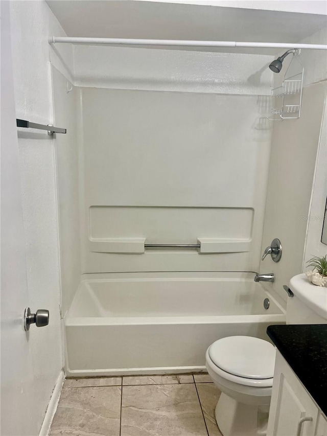 731 Wyman Ct Unit 731-A, Orlando, FL 32809 - full bathroom with bathing tub / shower combination, toilet, tile patterned flooring, and vanity