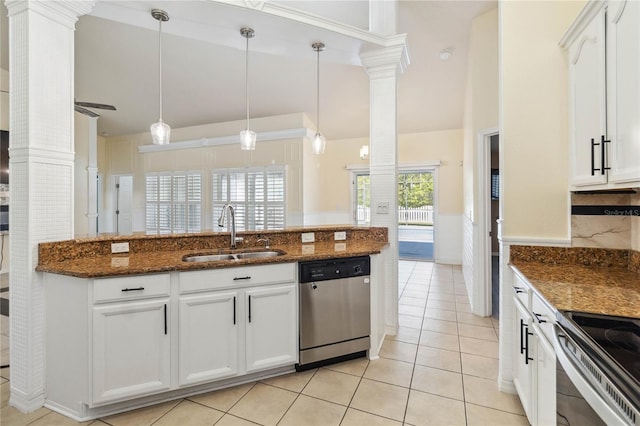 kitchen with a sink, vaulted ceiling, decorative columns, and stainless steel appliances