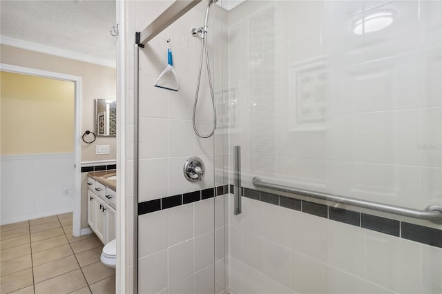 full bath with tile patterned floors, a shower stall, and vanity