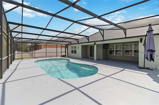 view of swimming pool featuring a fenced in pool, a patio, and a lanai