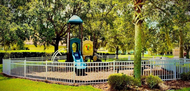 communal playground featuring fence