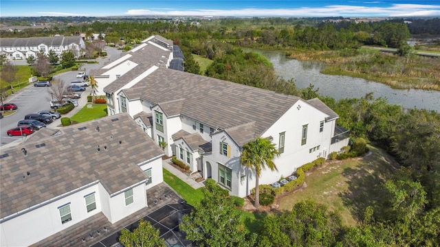 birds eye view of property featuring a residential view and a water view