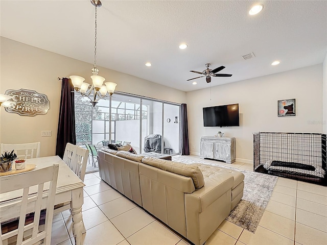 living room with light tile patterned floors, visible vents, and recessed lighting