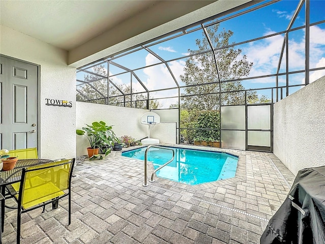 outdoor pool featuring a lanai and a patio