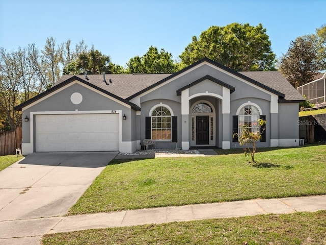 ranch-style house with stucco siding, driveway, an attached garage, and a front yard