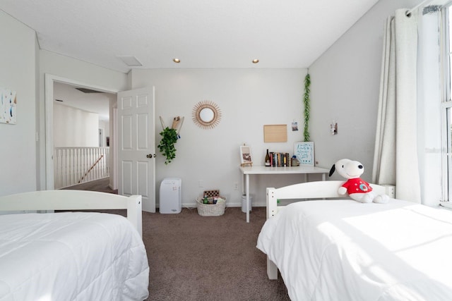 carpeted bedroom with baseboards