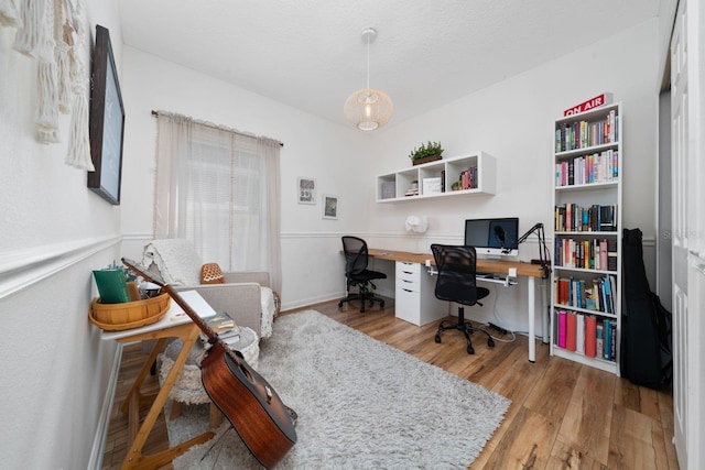 office with hardwood / wood-style flooring