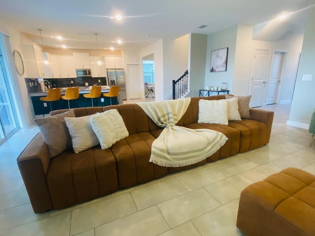 living area with light tile patterned floors