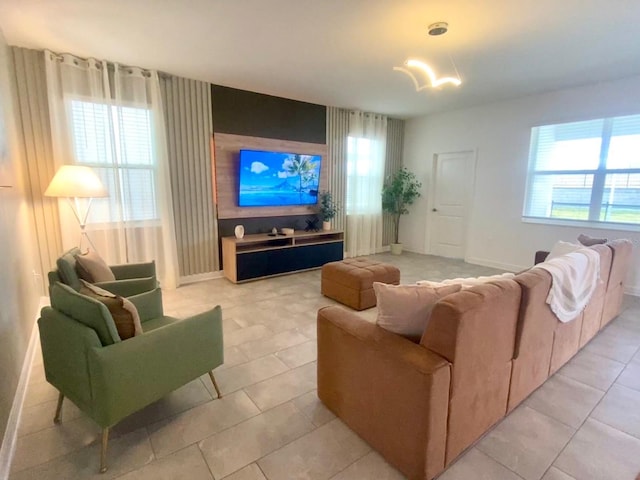 living area with a wealth of natural light and baseboards