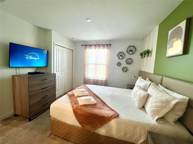 carpeted bedroom with a closet