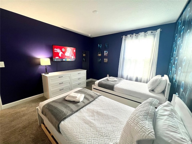 bedroom with carpet and baseboards