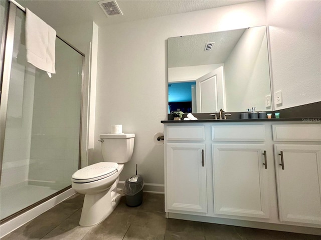 full bathroom featuring tile patterned floors, visible vents, toilet, and a stall shower