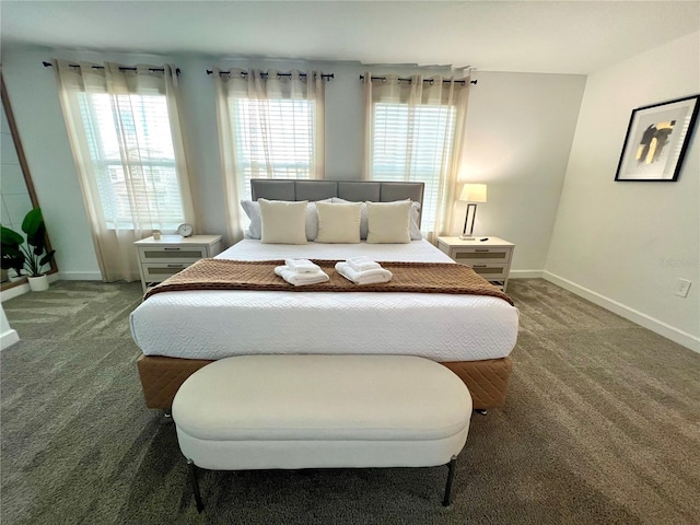 carpeted bedroom with baseboards