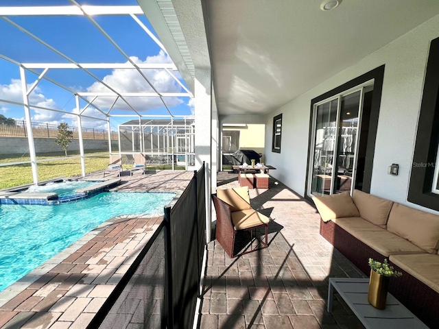 view of patio / terrace featuring an outdoor living space, a lanai, and a pool with connected hot tub