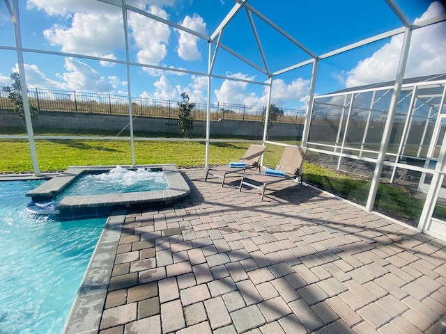 view of patio with glass enclosure, an outdoor hot tub, and fence