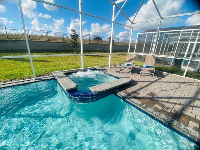 view of swimming pool featuring glass enclosure, a yard, a patio area, and fence