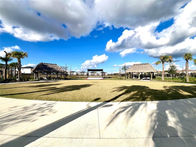 view of property's community with a gazebo and a yard