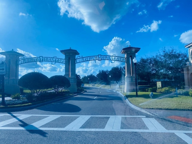 view of road with curbs and street lights