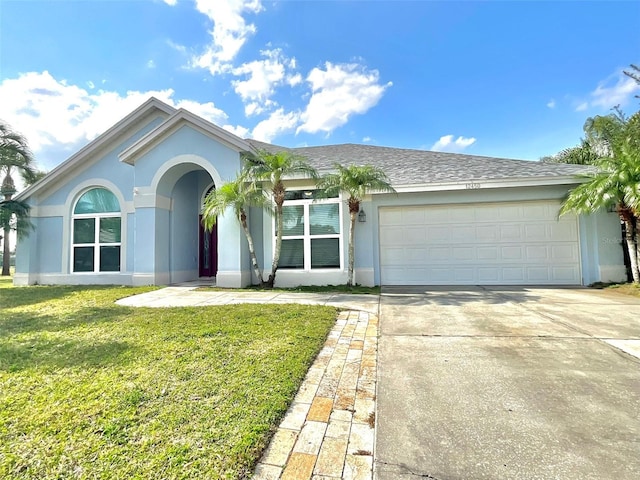 ranch-style home with a front yard, a garage, driveway, and stucco siding