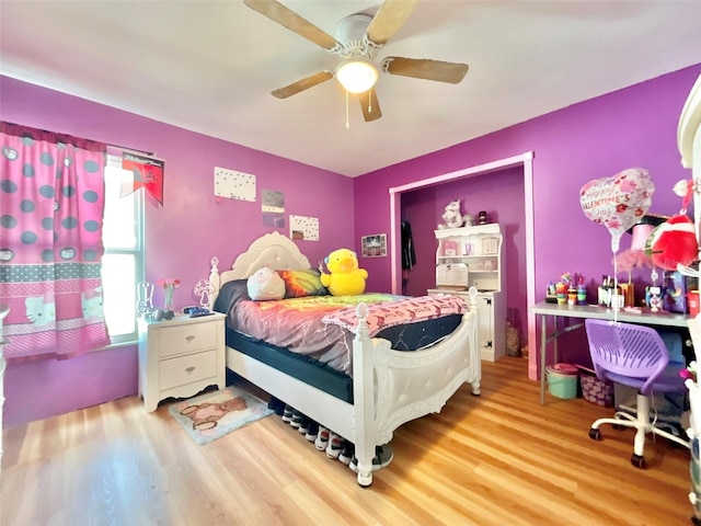 bedroom featuring wood finished floors and a ceiling fan