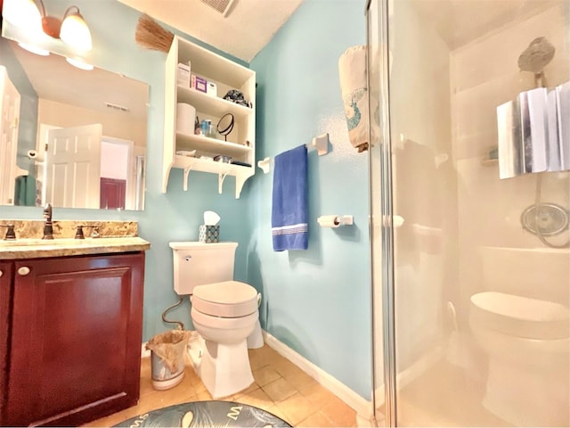 full bathroom with vanity, baseboards, a stall shower, tile patterned flooring, and toilet