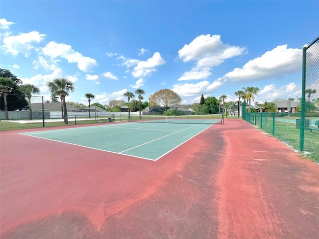 view of sport court with fence