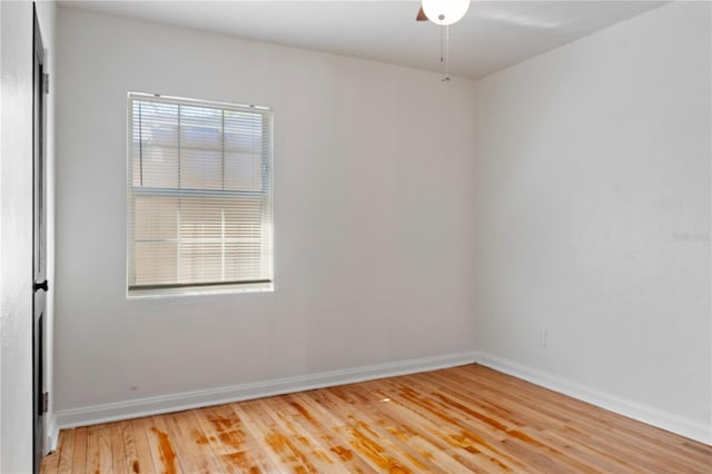 spare room with light wood-style flooring and baseboards