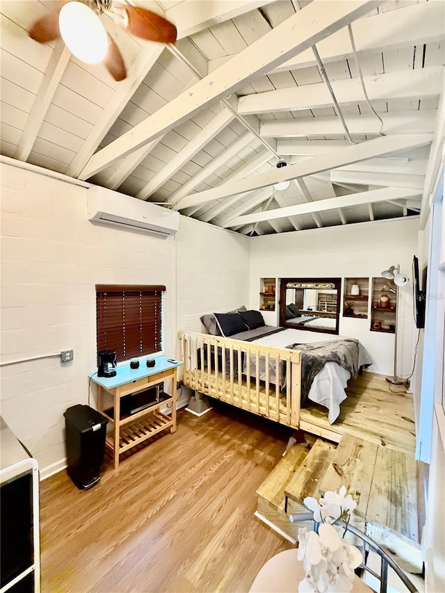 bedroom with an AC wall unit, lofted ceiling with beams, wood finished floors, and wooden ceiling