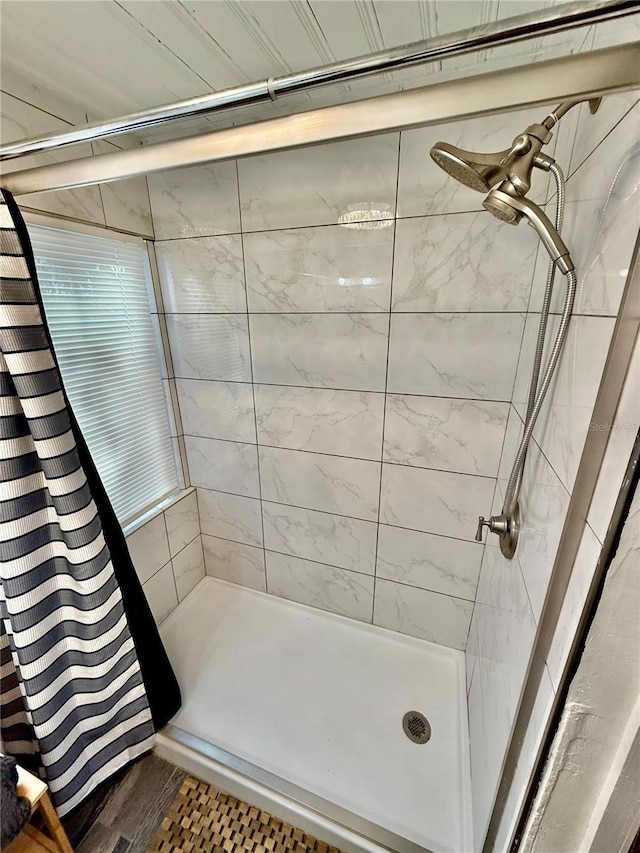 bathroom with a shower stall