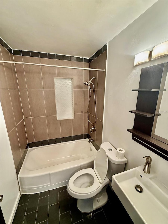 full bath featuring a sink, toilet, shower / bathtub combination, and tile patterned floors