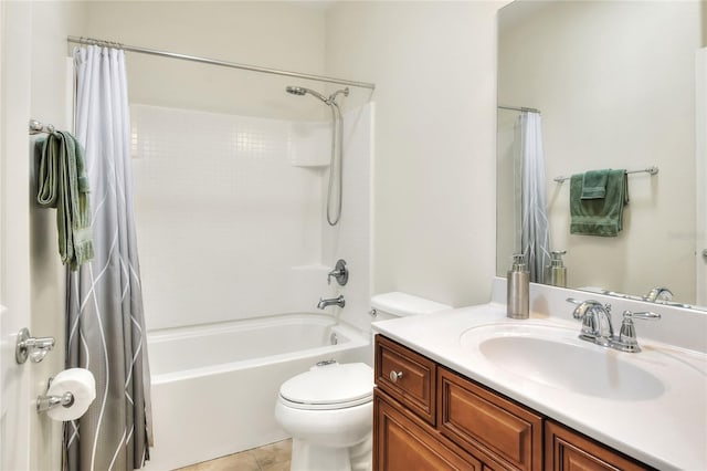 full bath with vanity, shower / tub combo, toilet, and tile patterned flooring