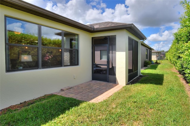 view of yard with a patio and a sunroom