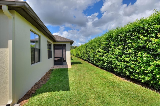 view of yard with a sunroom