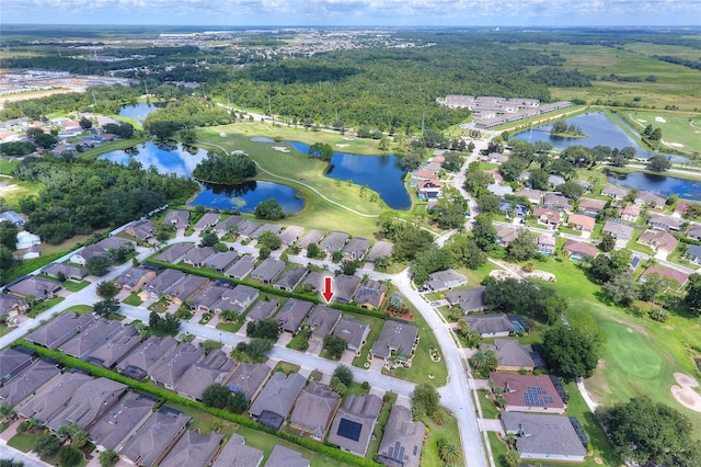 aerial view featuring a residential view, a water view, and view of golf course