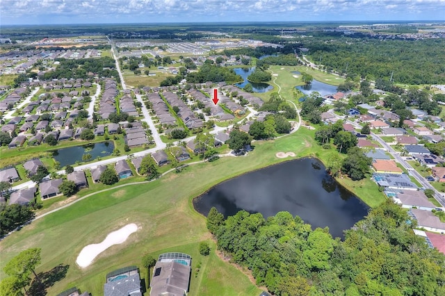 birds eye view of property with golf course view, a water view, and a residential view