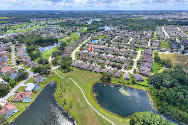 drone / aerial view with a residential view and a water view