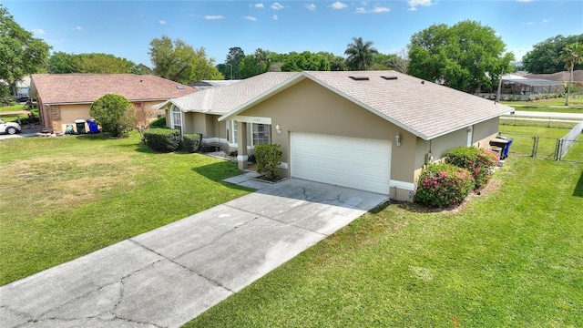 single story home with stucco siding, driveway, a front lawn, fence, and an attached garage