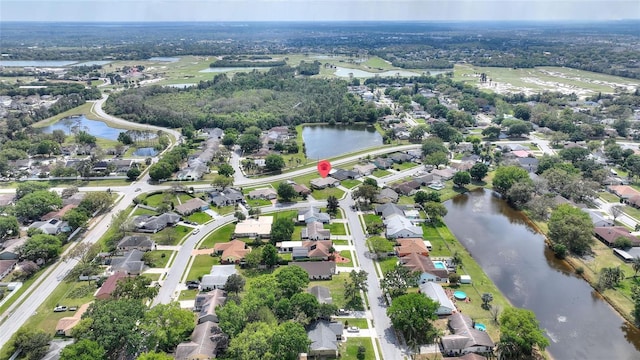 birds eye view of property with a residential view and a water view