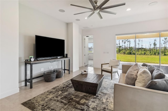 living room featuring light tile patterned floors, baseboards, recessed lighting, and a ceiling fan