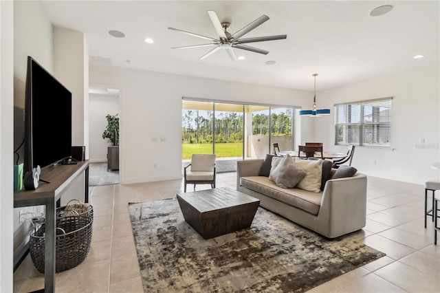 living room with light tile patterned floors, baseboards, visible vents, recessed lighting, and ceiling fan