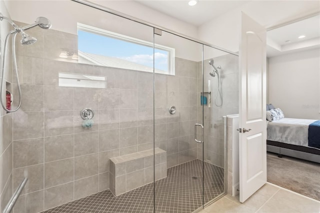 bathroom featuring tile patterned flooring, recessed lighting, a shower stall, and ensuite bathroom