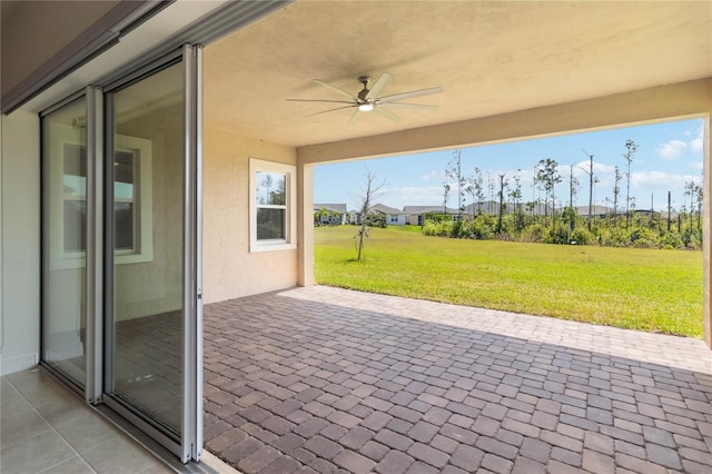 view of patio with ceiling fan