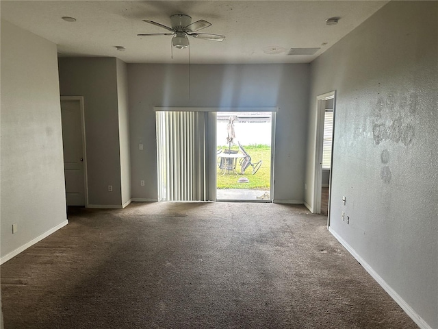 spare room with visible vents, baseboards, a ceiling fan, and carpet floors