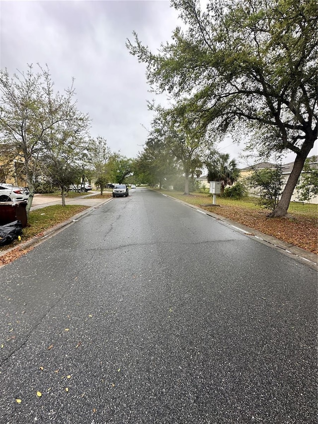 view of street featuring curbs