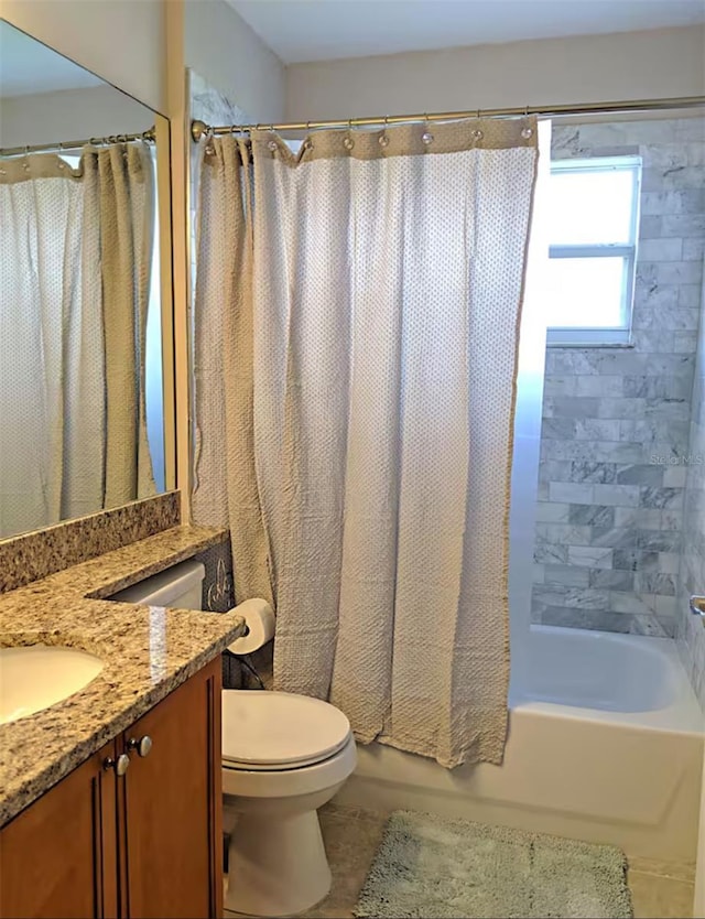 bathroom featuring vanity, toilet, and shower / tub combo