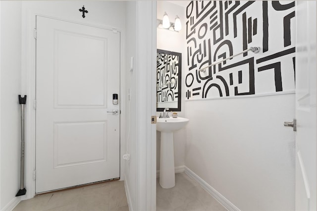 bathroom featuring tile patterned floors and baseboards