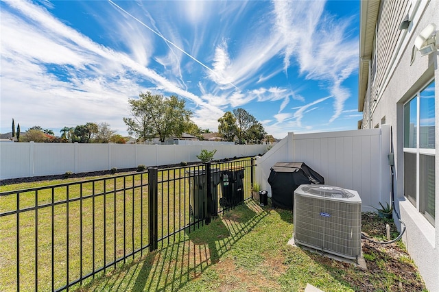 view of yard featuring cooling unit and a fenced backyard