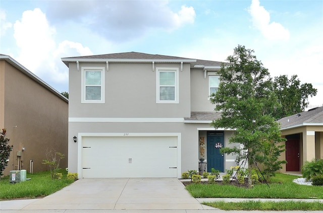 traditional-style home featuring stucco siding, an attached garage, concrete driveway, and a shingled roof